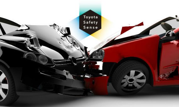 Gray and Red Car in Crash with Toyota Safety Sense Logo in Background