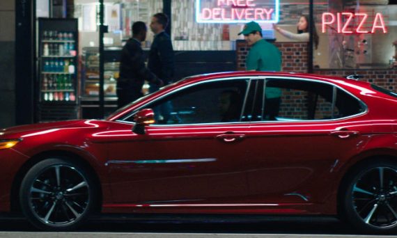 Red 2018 Toyota Camry Side Exterior in Front of Pizza Parlor