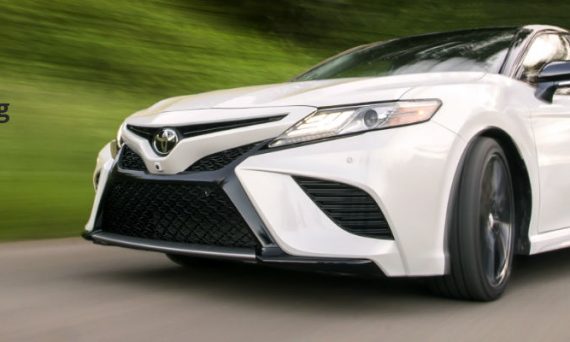 White 2018 Toyota Camry Front Exterior in Motion on Wooded Road