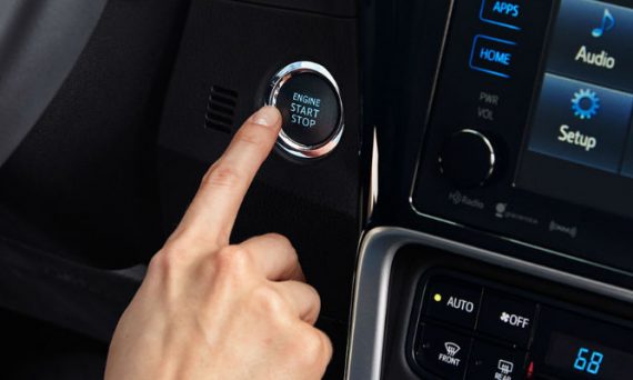 Close Up of Finger Pressing Engine Start/Stop Button in 2018 Toyota Corolla