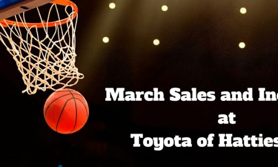 Basketball Going Through Hoop in an Arena with White March Sales and Incentives at Toyota of Hattiesburg Text