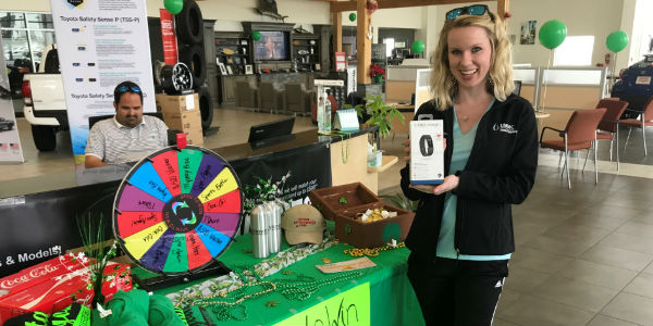 Winner of Fitbit at Toyota of Hattiesburg Lucky Leprechaun Madness Sale in Front of Prize Wheel