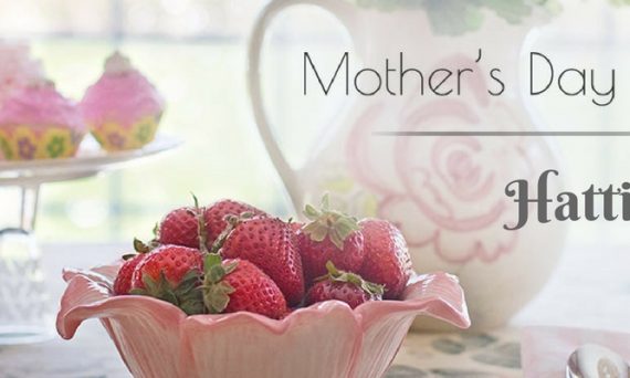 Cupcakes and Strawberries on a Table with Black Mother's Day Brunch in Hattiesburg Text