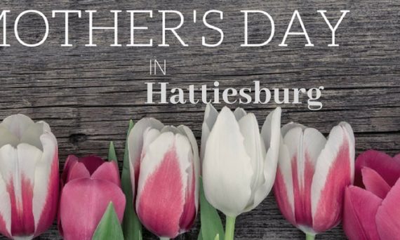 Pink and White Tulips on a Dark Wood Background with White Mother's Day in Hattiesburg Text