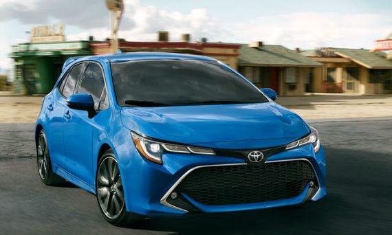 Blue 2019 Toyota Corolla Hatchback XSE Driving Past an Old Diner