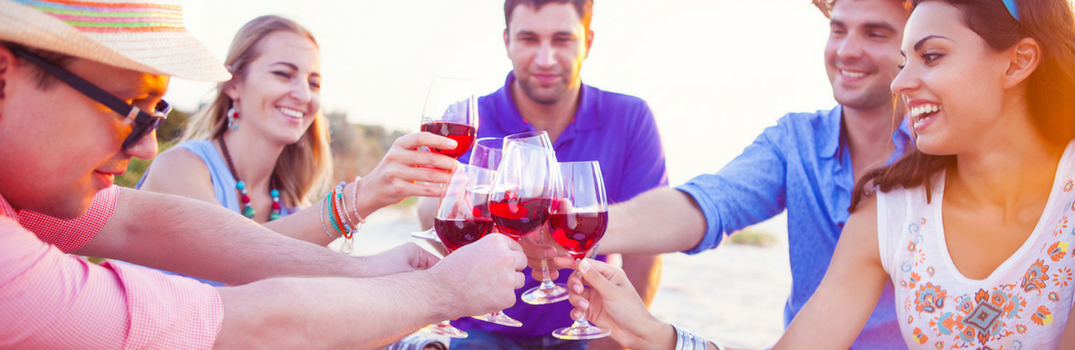 people raising their glasses