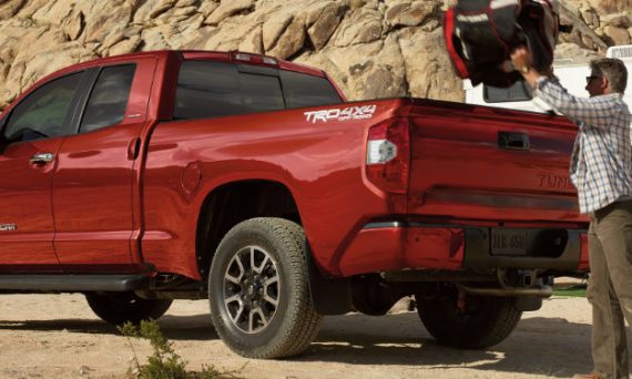 man loading cargo into 2019 Toyota Tundra