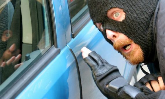 burglar breaking into car
